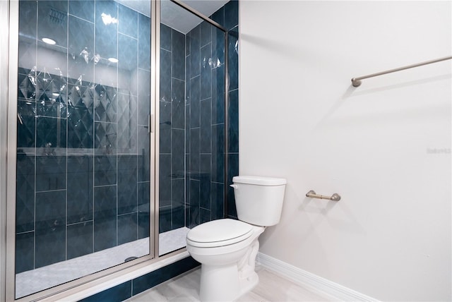 bathroom featuring an enclosed shower and toilet