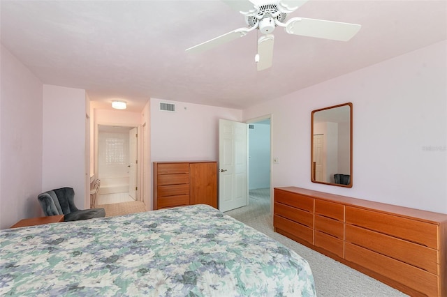 bedroom featuring light colored carpet and ceiling fan