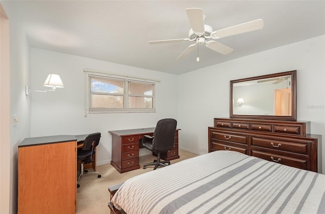 bedroom with ceiling fan and light carpet