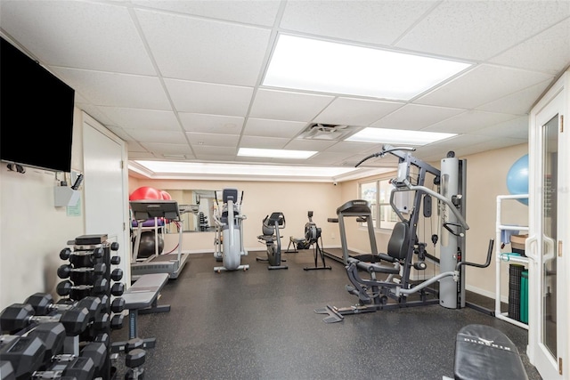 gym featuring a drop ceiling