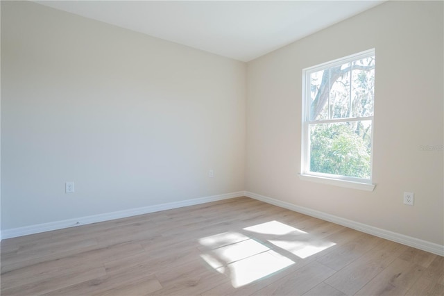 empty room with a healthy amount of sunlight and light wood-type flooring