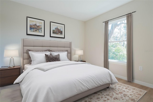 bedroom with light hardwood / wood-style flooring