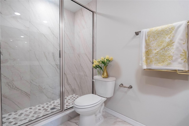 bathroom featuring an enclosed shower and toilet