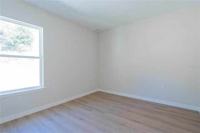 empty room with light hardwood / wood-style floors