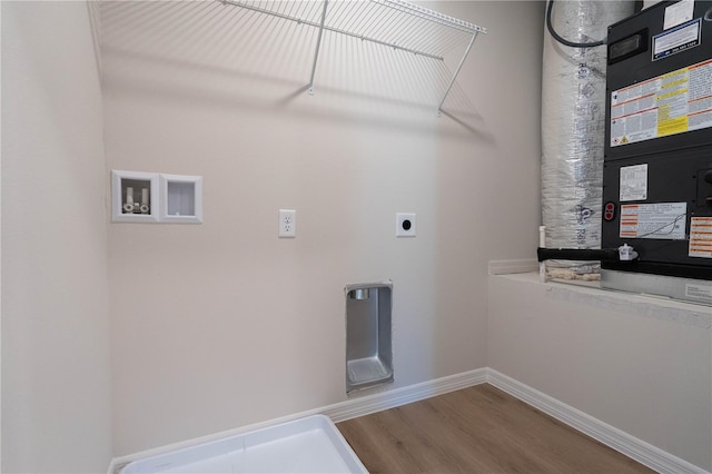 washroom featuring electric dryer hookup, hookup for a washing machine, and wood-type flooring