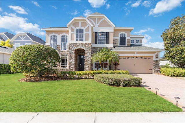 view of front facade featuring a garage and a front lawn