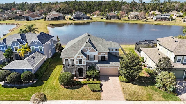 birds eye view of property featuring a water view