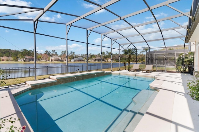 view of swimming pool with a water view, a patio, and glass enclosure