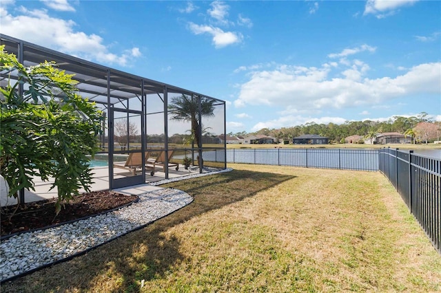 view of yard featuring a fenced in pool, a patio area, and glass enclosure