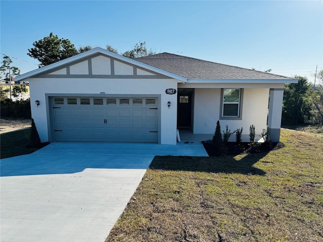 ranch-style home with a garage and a front yard