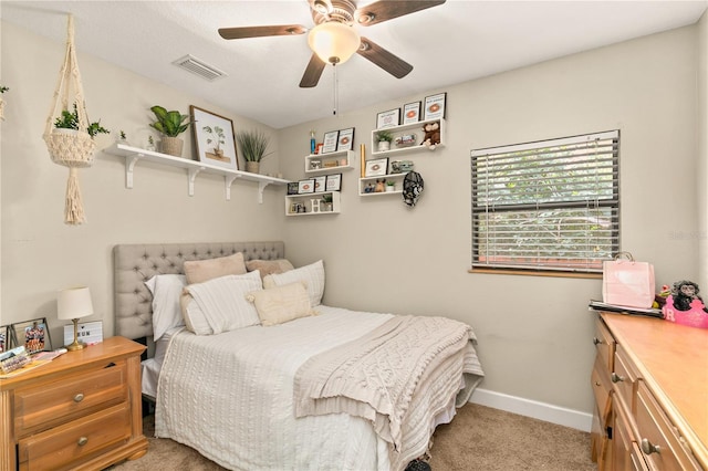 bedroom with ceiling fan and light colored carpet