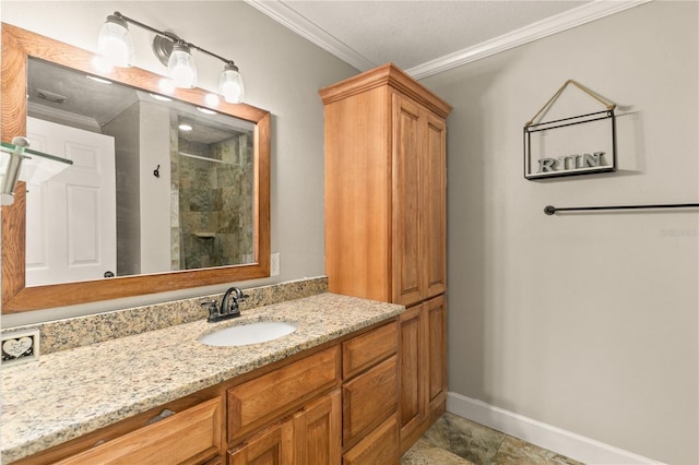 bathroom with crown molding, a shower, and vanity