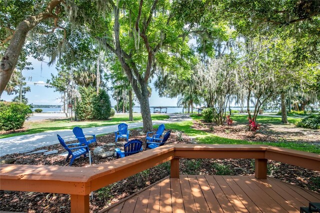 2929 Lakeshore Dr, Mount Dora, FL 32757 - deck with a water view and an outdoor fire pit