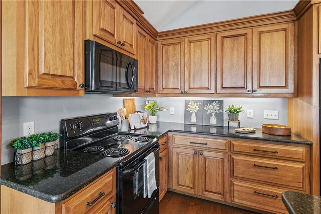 2929 Lakeshore Dr, Mount Dora, FL 32757 - kitchen with black appliances, brown cabinetry, lofted ceiling, dark stone countertops, and dark wood finished floors