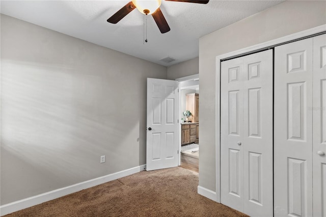 2929 Lakeshore Dr, Mount Dora, FL 32757 - unfurnished bedroom featuring carpet floors, baseboards, a closet, and a ceiling fan
