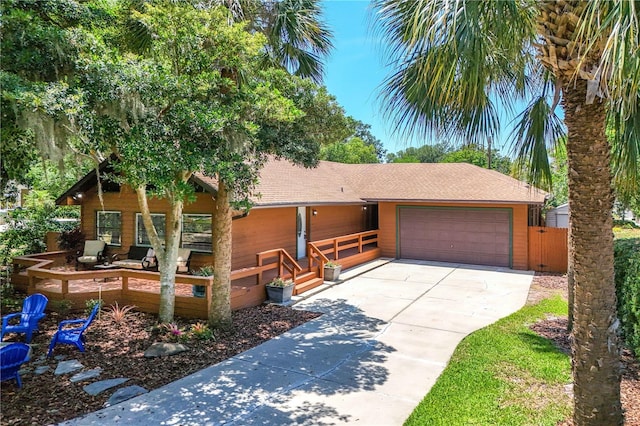 2929 Lakeshore Dr, Mount Dora, FL 32757 - view of front facade featuring driveway, an attached garage, and a shingled roof