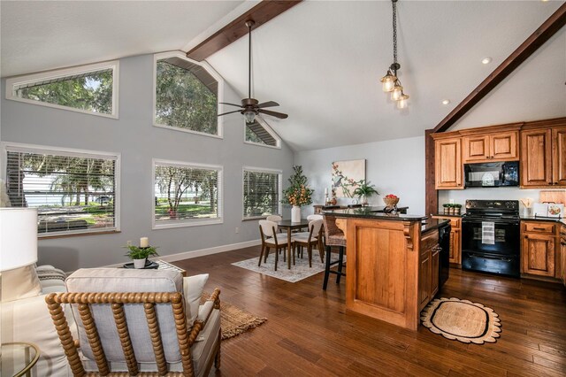 2929 Lakeshore Dr, Mount Dora, FL 32757 - kitchen with black appliances, dark countertops, high vaulted ceiling, ceiling fan, and a breakfast bar area