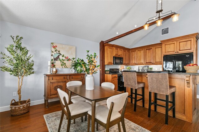 2929 Lakeshore Dr, Mount Dora, FL 32757 - dining space with lofted ceiling, dark wood-style flooring, and baseboards