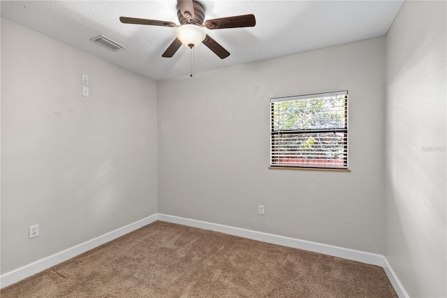 2929 Lakeshore Dr, Mount Dora, FL 32757 - carpeted spare room with baseboards, a ceiling fan, and a textured ceiling