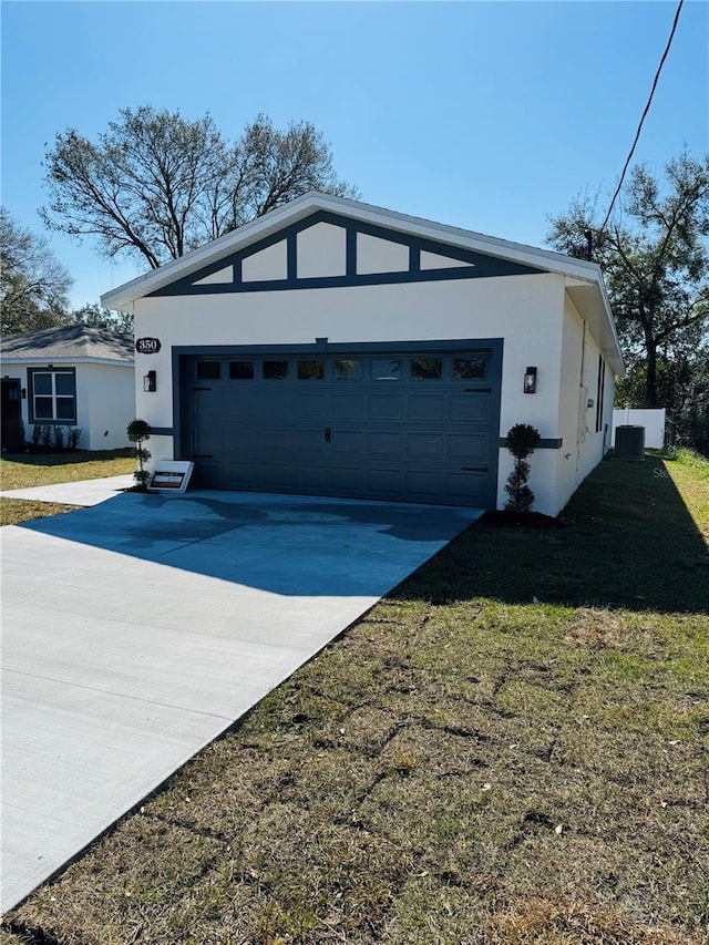 exterior space with a garage and a lawn