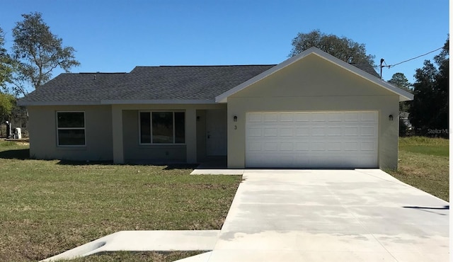 single story home with a garage and a front lawn