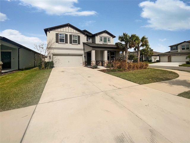 view of front of property with a garage and a front yard