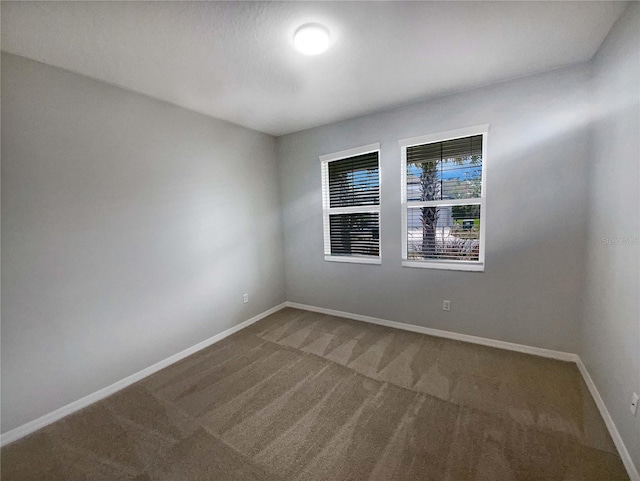 unfurnished room with carpet floors