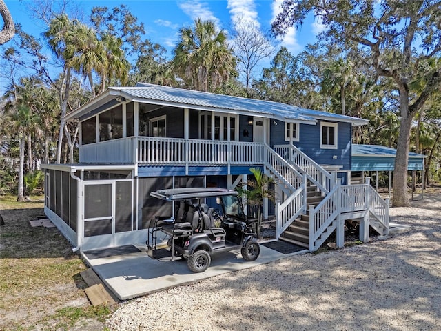 view of front facade with a sunroom