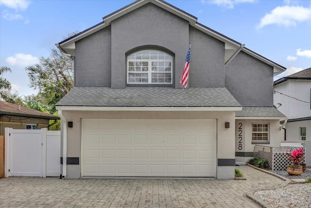 front facade with a garage