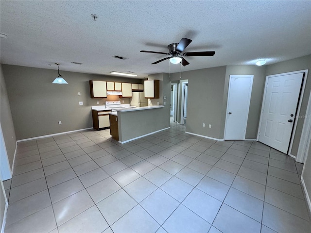 kitchen featuring pendant lighting, light tile patterned floors, white appliances, ceiling fan, and a textured ceiling