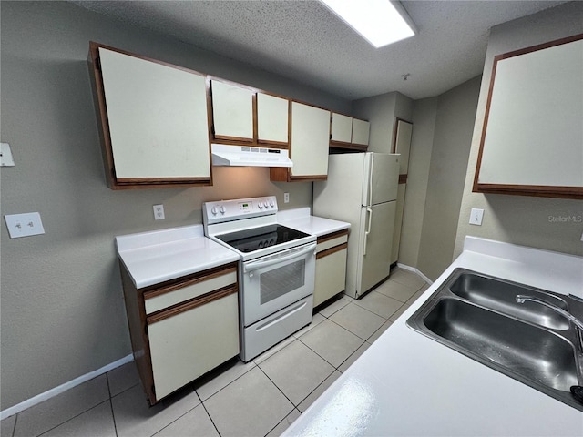 kitchen with white cabinetry, sink, white appliances, and light tile patterned flooring