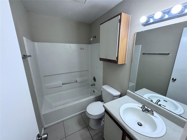 full bathroom featuring toilet, shower / bathing tub combination, a textured ceiling, vanity, and tile patterned flooring