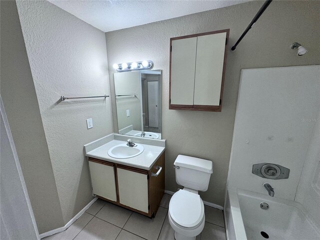 full bathroom featuring tile patterned flooring, vanity,  shower combination, and toilet