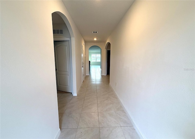 corridor featuring light tile patterned flooring