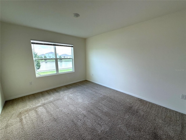 unfurnished room featuring carpet flooring