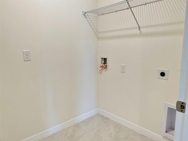 washroom with light tile patterned flooring, washer hookup, and electric dryer hookup