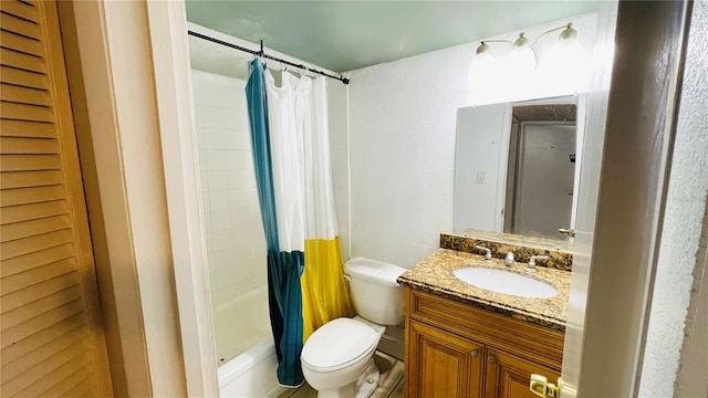 full bathroom with vanity, toilet, and shower / tub combo with curtain