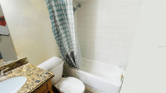 full bathroom featuring vanity, shower / tub combo with curtain, and toilet