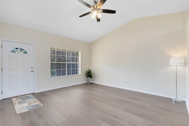 entrance foyer featuring ceiling fan, lofted ceiling, and light hardwood / wood-style floors