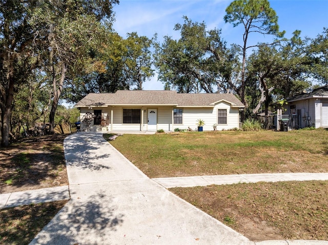 single story home with a front lawn