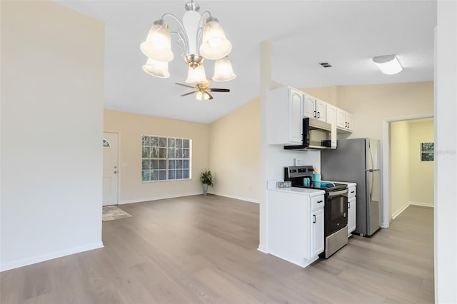 kitchen with lofted ceiling, stainless steel electric range, white cabinets, ceiling fan with notable chandelier, and light wood-type flooring