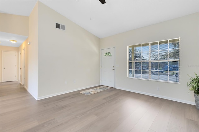 interior space with high vaulted ceiling, light hardwood / wood-style floors, and ceiling fan