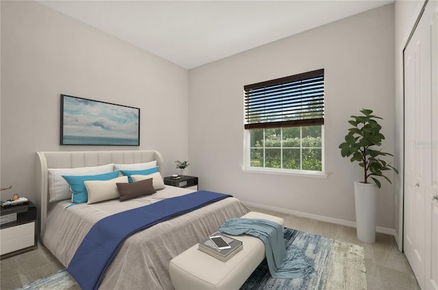 301 E Fiesta Key Loop, Deland, FL 32720 - bedroom featuring baseboards, light carpet, and a closet