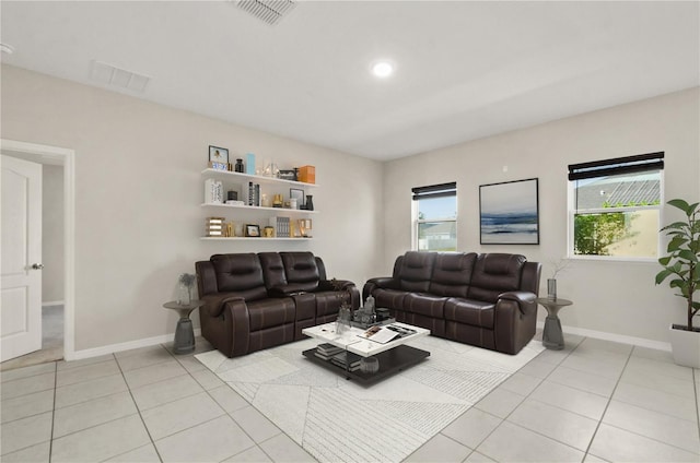 301 E Fiesta Key Loop, Deland, FL 32720 - living room with visible vents, baseboards, and light tile patterned flooring