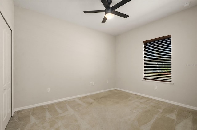 301 E Fiesta Key Loop, Deland, FL 32720 - unfurnished bedroom with baseboards, light carpet, a closet, and a ceiling fan