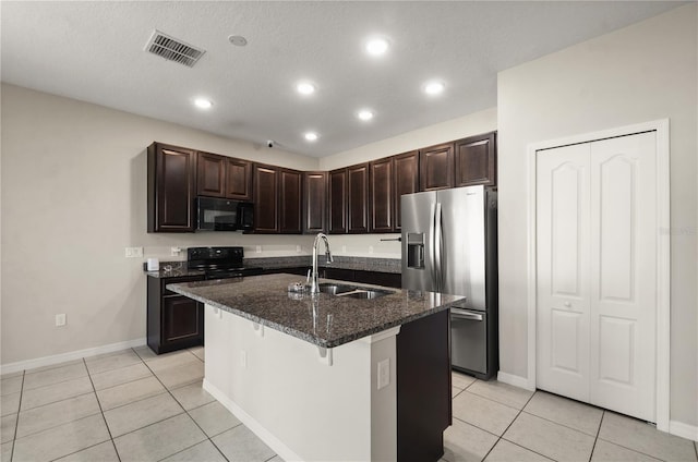 301 E Fiesta Key Loop, Deland, FL 32720 - kitchen with a sink, light tile patterned flooring, black appliances, and visible vents