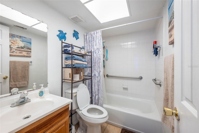 full bathroom featuring vanity, tile patterned floors, toilet, and shower / bath combo