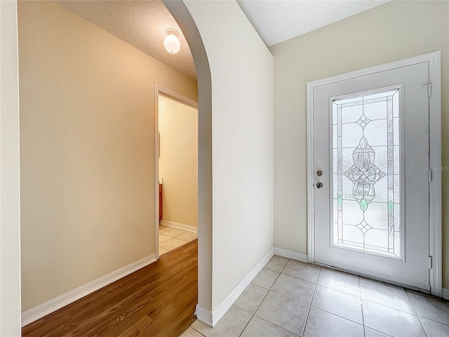 entryway featuring light tile patterned floors