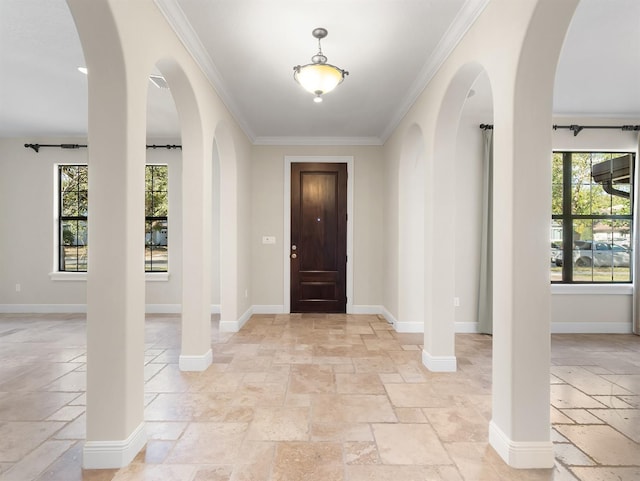 foyer featuring ornamental molding