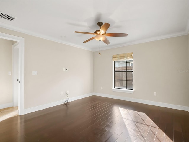 spare room featuring wood-type flooring, ceiling fan, and crown molding